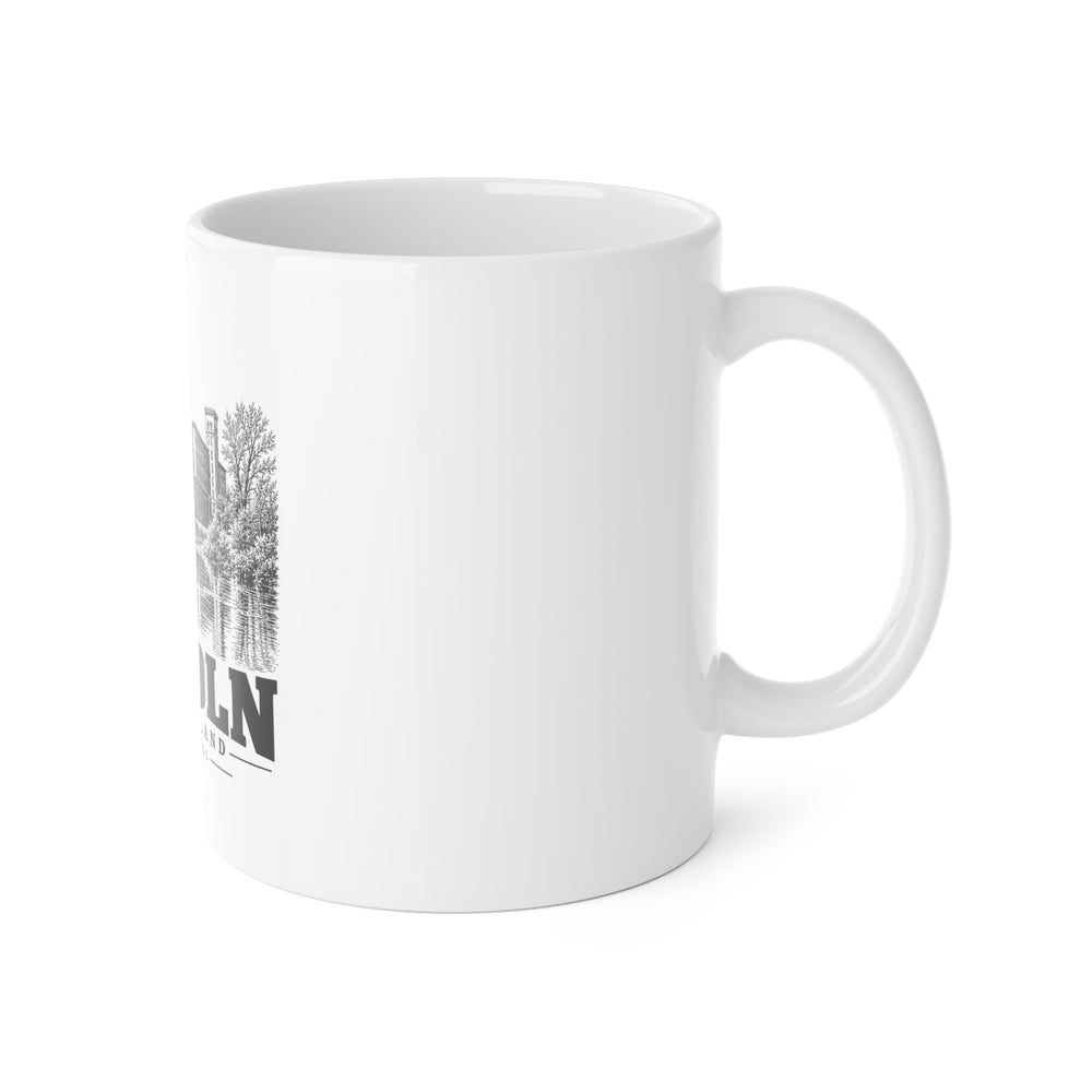 Right-side view of white 11 oz Albion Mill mug, handle on the right and partial front print, Lincoln, Rhode Island