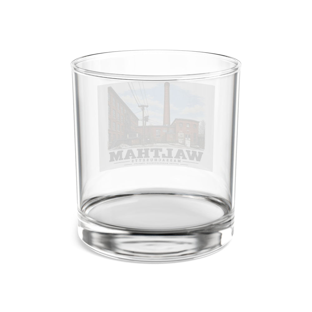 Rear view of the clear rocks glass with Boston Manufacturing Company artwork visible through the glass.