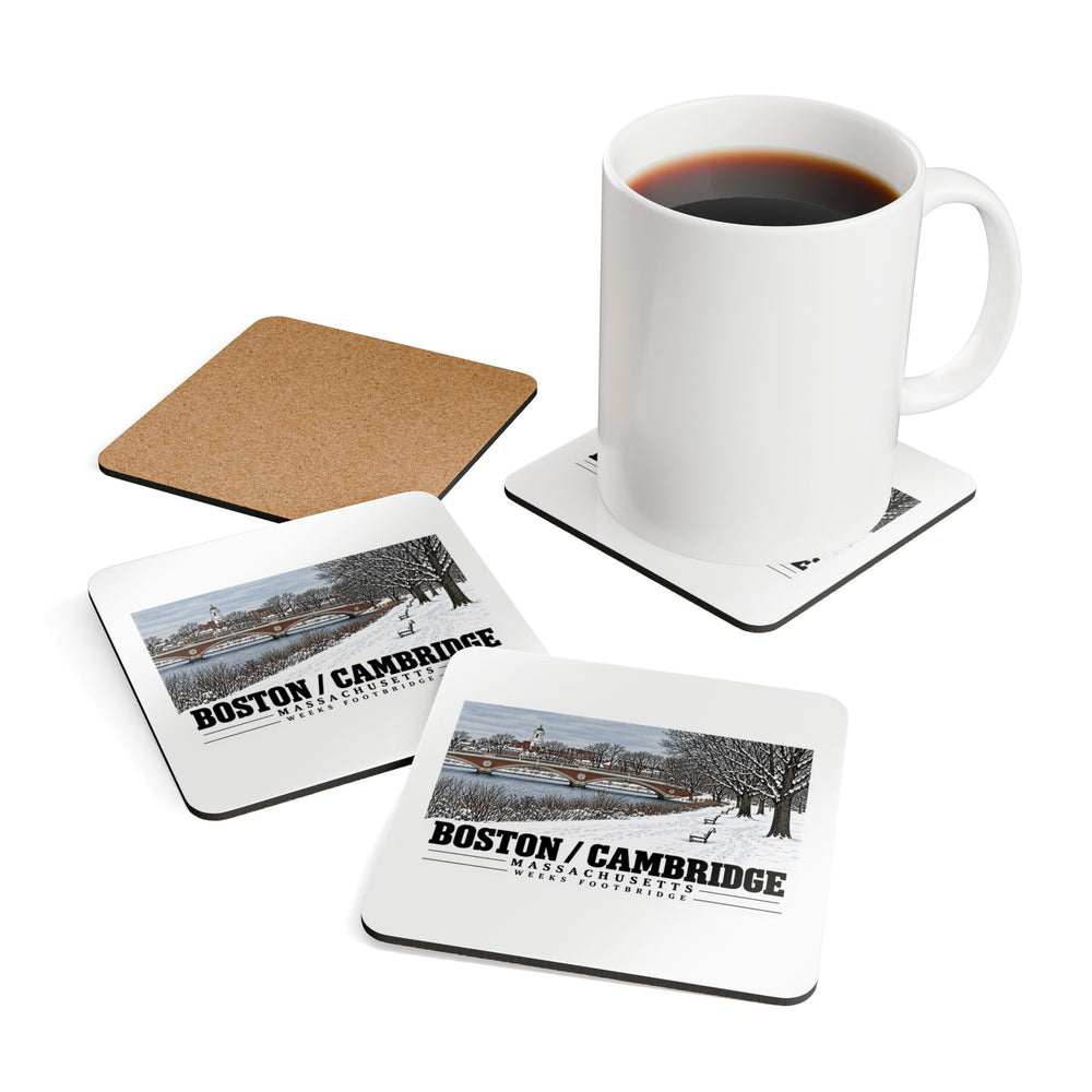 Coasters showing Weeks Footbridge winter riverbank view with snow and benches artwork beside a plain white mug of coffee and a coaster's cork reverse