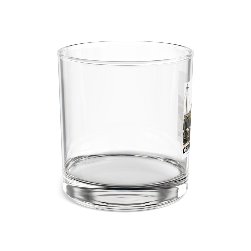 Right side of clear rocks glass showing edge of Water Battery artwork