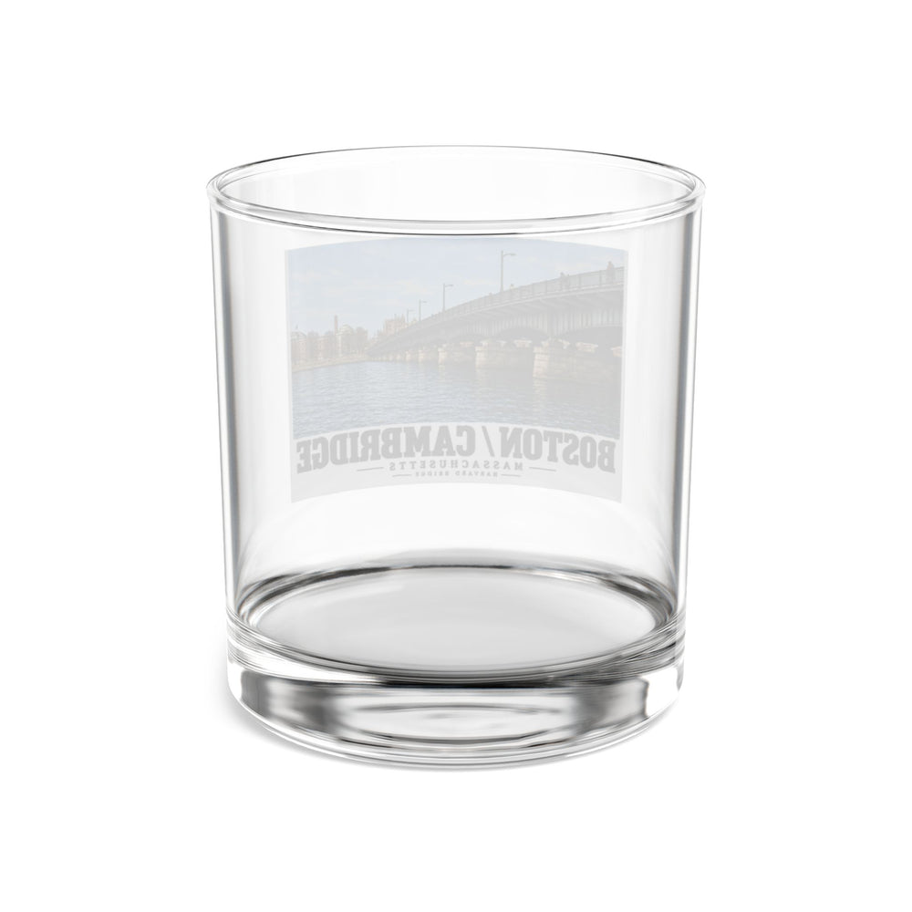 Clear rocks glass rear view showing the reversed Harvard Bridge print through the glass
