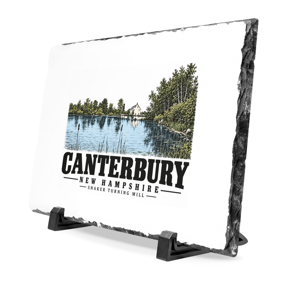 Angled front on display stands of Shaker Turning Mill slate desk plaque, with Canterbury, New Hampshire artwork and lettering.