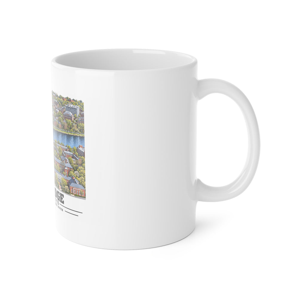 White ceramic mug with its handle on the right and part of the Cambridge design visible on the left.