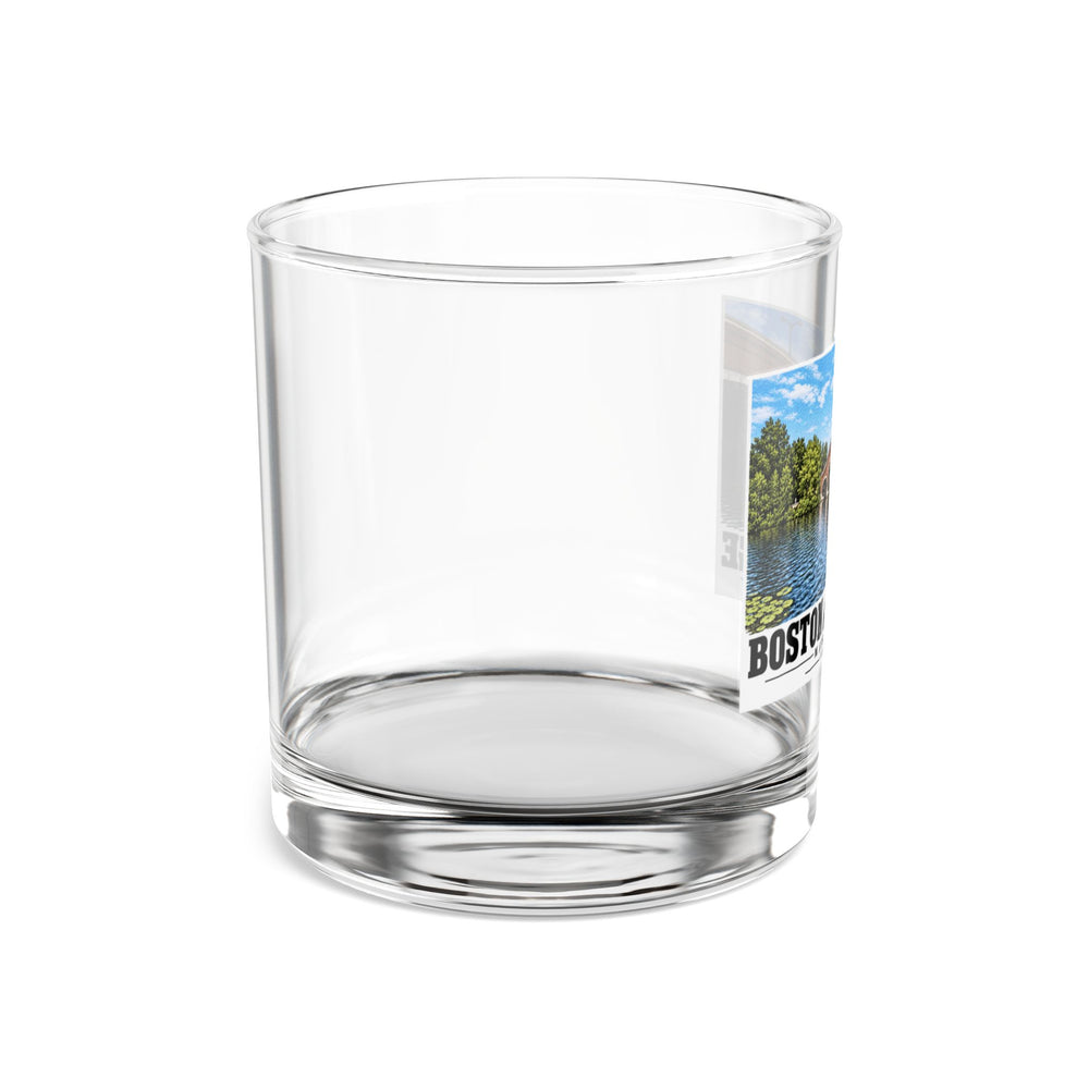 Side view of clear rocks glass with mostly unprinted surface and part of Eliot Bridge close red brick arch view print at right