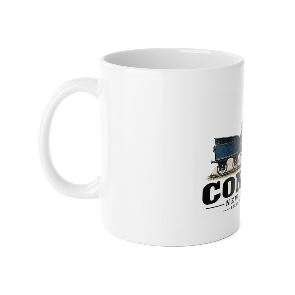 Left-handle side view of First Passenger Engine white ceramic mug, Concord, New Hampshire.