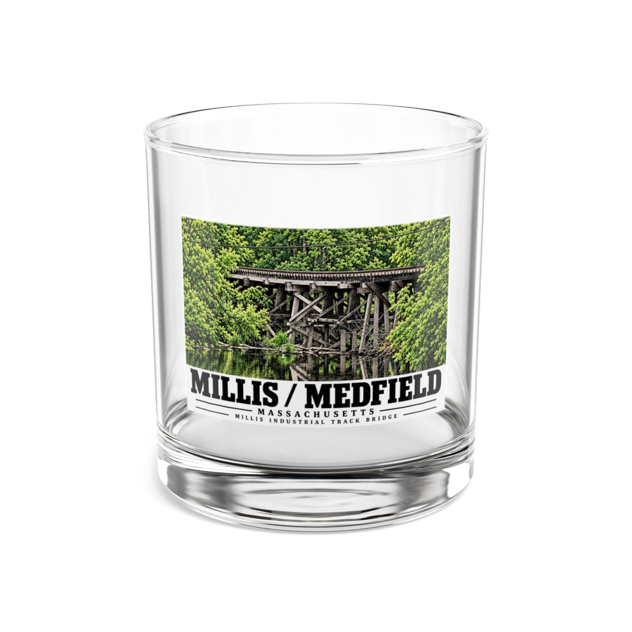 Clear rocks glass showing Millis Industrial Track wooden railway trestle and green foliage artwork and Millis/Medfield lettering