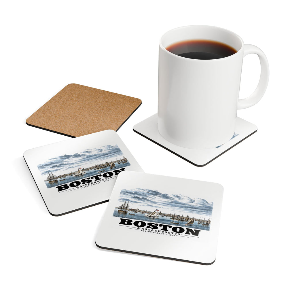 Coasters showing Boston Harbor waterfront scene with sailing ships artwork beside a plain white mug of coffee and a coaster's cork reverse