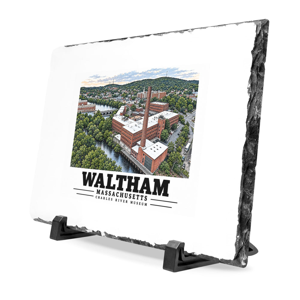 Angled view of the Waltham Charles River Museum slate desk plaque on black stands.