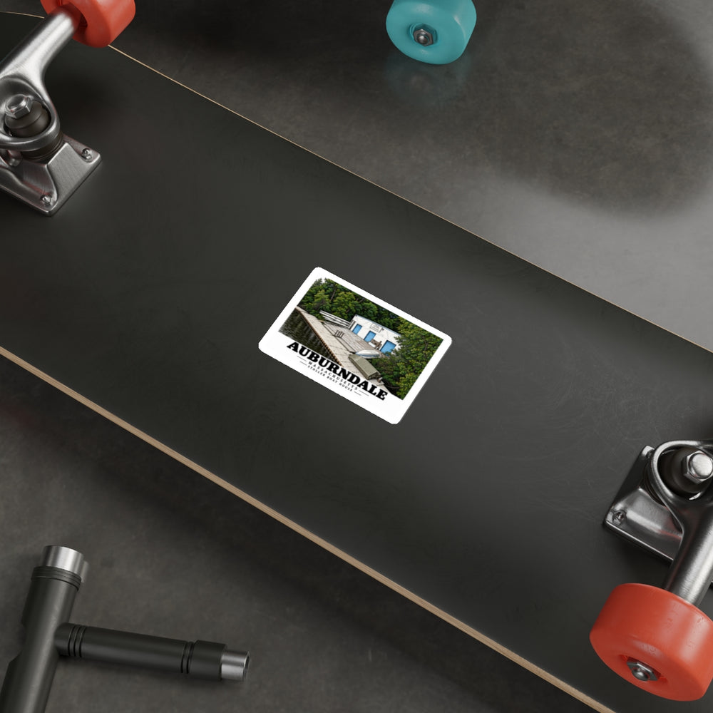 Auburndale Stoller Boathouse sticker on the underside of a skateboard.