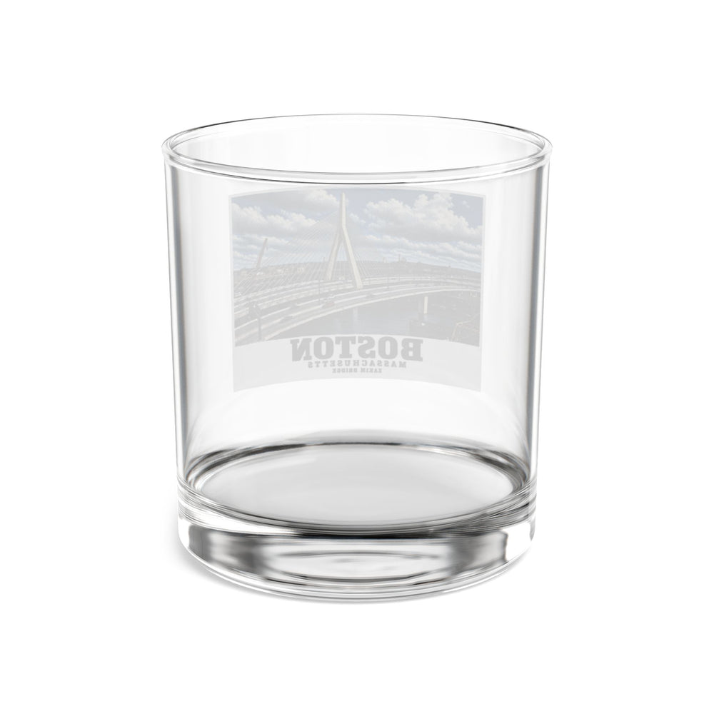 Rear view of clear rocks glass with Zakim Bunker Hill Bridge cable-stayed towers and Charles River print and reversed lettering visible through the glass