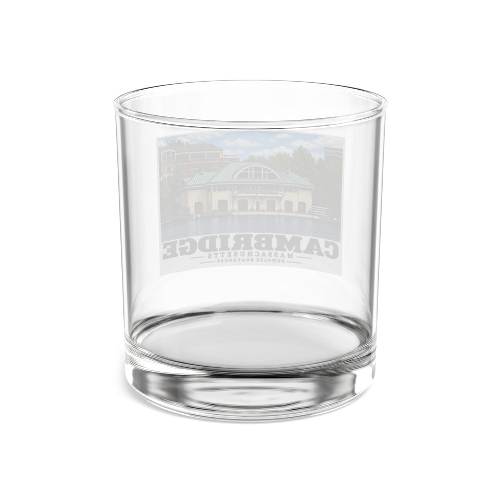 Back view of the clear rocks glass showing the reverse of the DeWolfe Boathouse artwork through the glass.