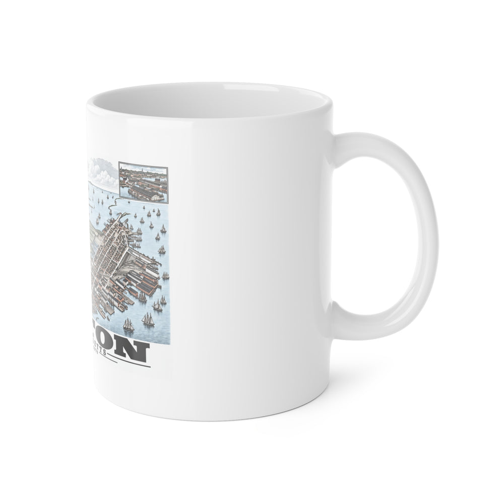 White mug with handle at right and part of the East Boston bird-eye city and harbor panorama with inset views print at left