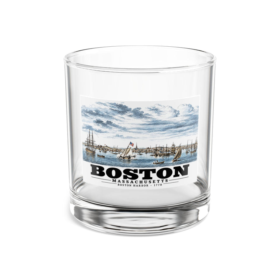 Clear rocks glass showing Boston Harbor waterfront scene with sailing ships artwork and Boston lettering