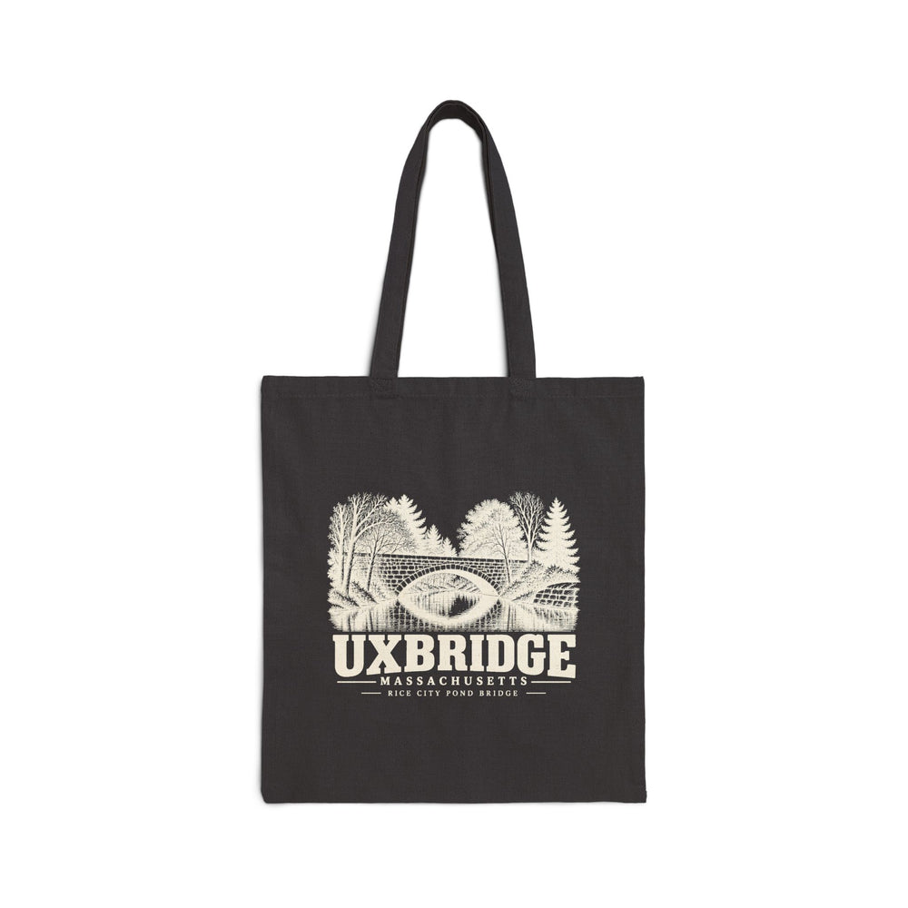 Black canvas tote with Uxbridge Rice City Pond Bridge artwork, front view