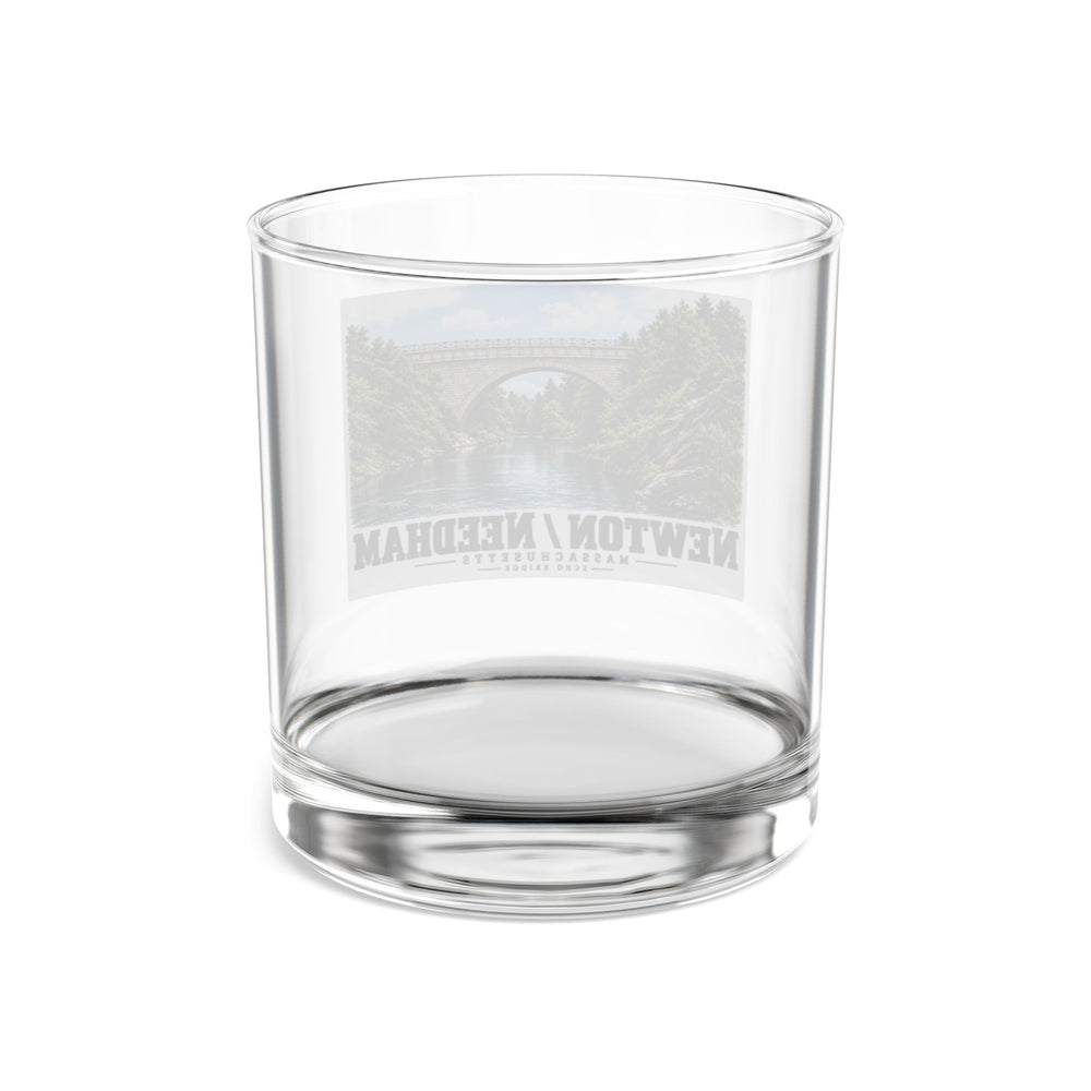 Reverse view of a clear rocks glass with the Echo Bridge design faintly visible through the glass.