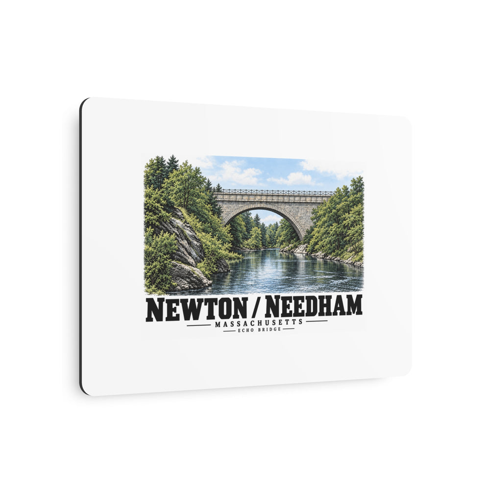 Angled metal wall art with Echo Bridge artwork showing a stone arch over a river and trees, with Newton/Needham lettering.