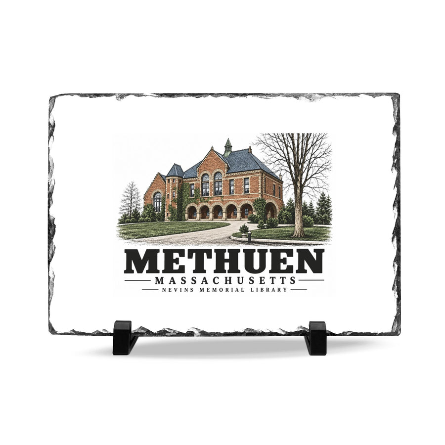 Front on display stands of Nevins Memorial Library slate desk plaque, with Methuen, Massachusetts artwork and lettering.