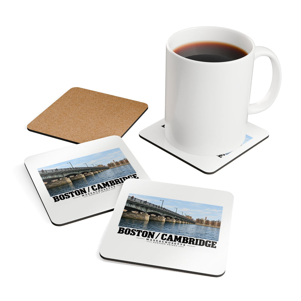 White mug resting on a coaster beside printed Harvard Bridge coaster fronts and a cork reverse