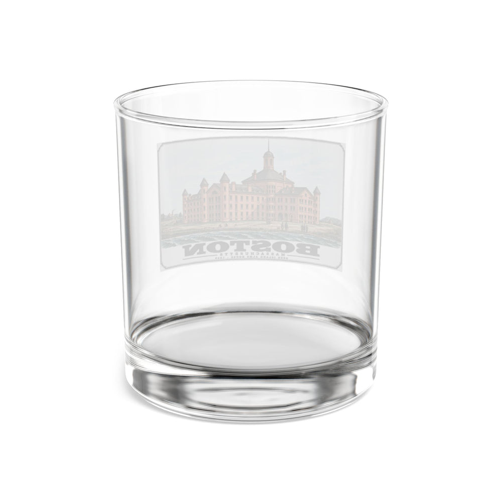 Rear view of clear rocks glass with large symmetrical alms house building, grounds and figures print and reversed lettering visible through the glass