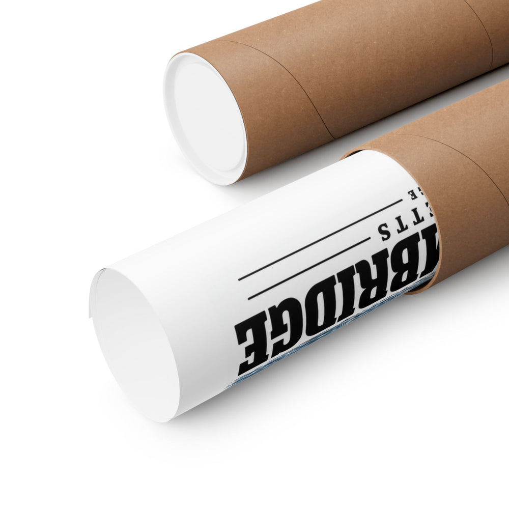 Partly rolled poster extending from a cardboard tube with partial Cambridge lettering and a narrow strip of the printed scene visible