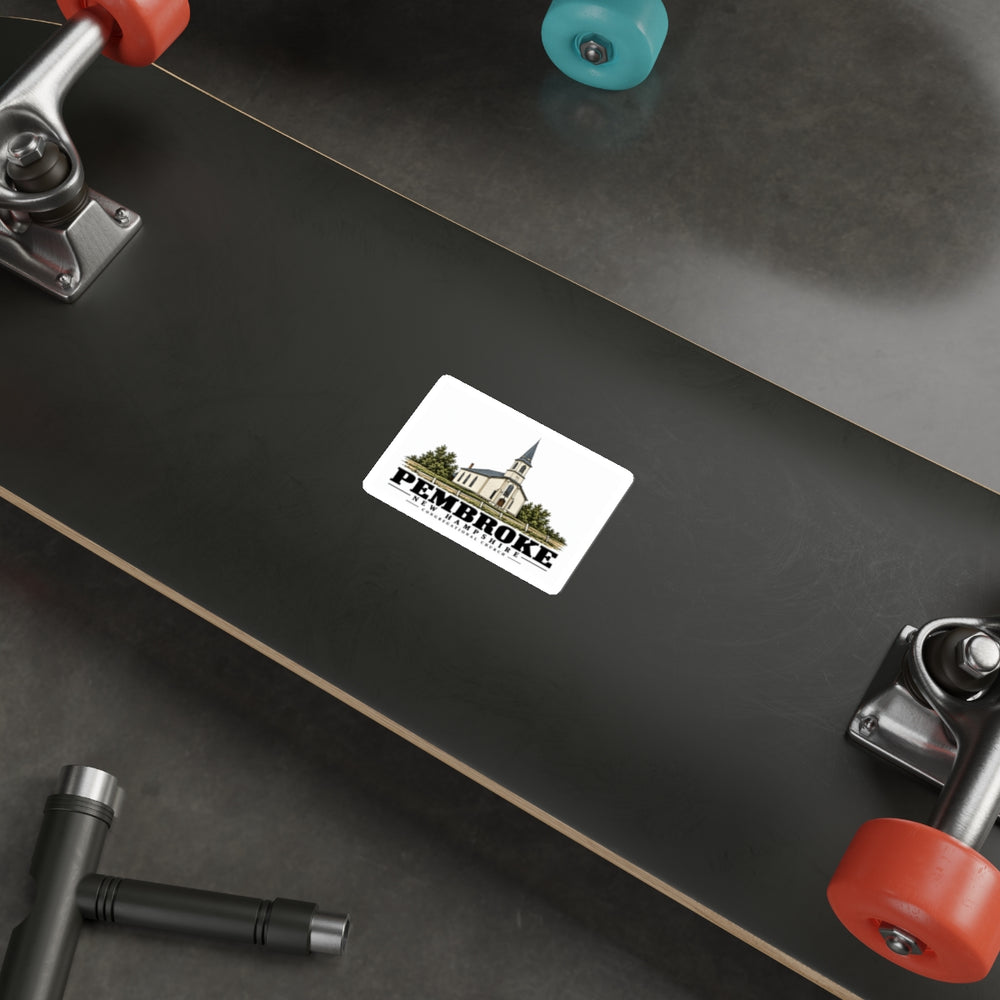 Skateboard display of Congregational Church white die-cut sticker, with Pembroke, New Hampshire artwork and lettering.