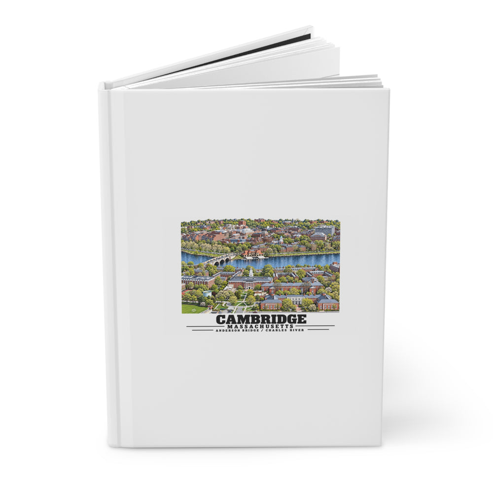 Partly opened hardcover journal with the Cambridge and Charles River design visible on its front cover.