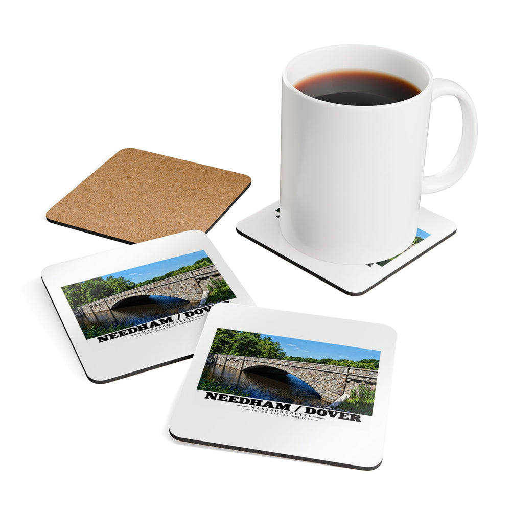 Coasters showing South Street Bridge stone arch and river artwork beside a plain white mug of coffee and a coaster's cork reverse