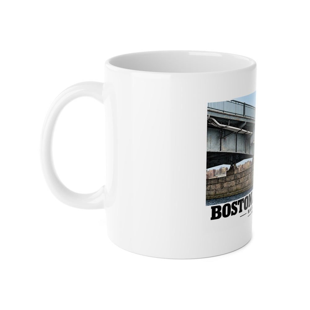 White mug with handle on the left and part of the Harvard Bridge print visible on the right