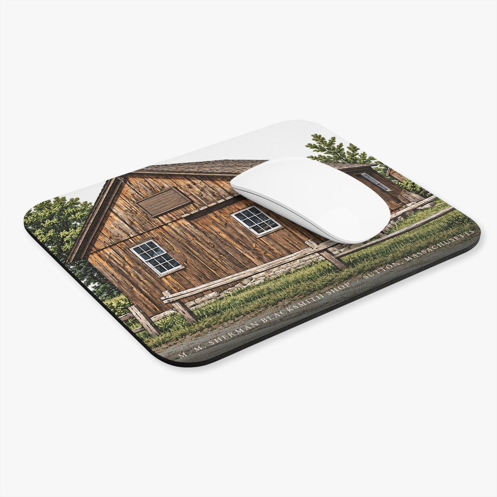 Sutton M. M. Sherman Blacksmith and Wheelwright Shop mouse pad shown on a desk with a mouse