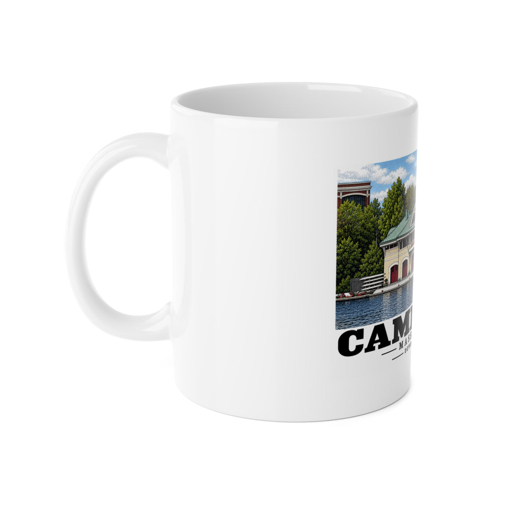 Left-handle view of the white ceramic mug with DeWolfe Boathouse artwork partly visible.
