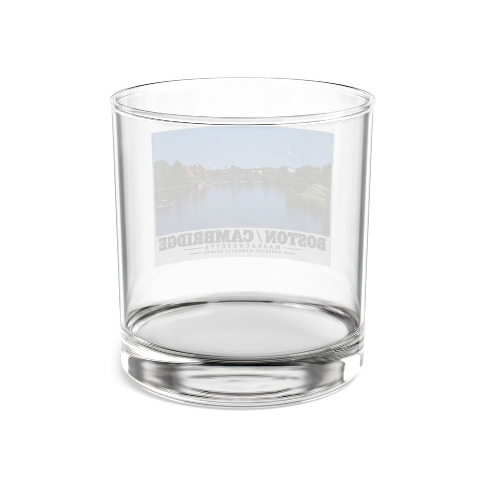 Rear view of clear rocks glass with Anderson Memorial Bridge distant river view print and reversed lettering visible through the glass