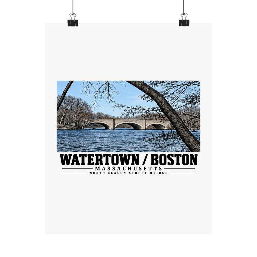 North Beacon Street Bridge stone arches framed by a bare tree poster with Watertown/Boston lettering hanging from two binder clips