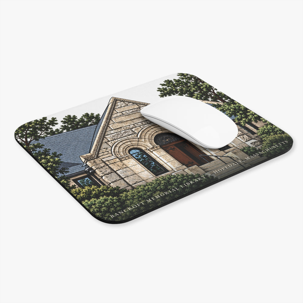 Hopedale Bancroft Memorial Library mouse pad shown on a desk with a mouse