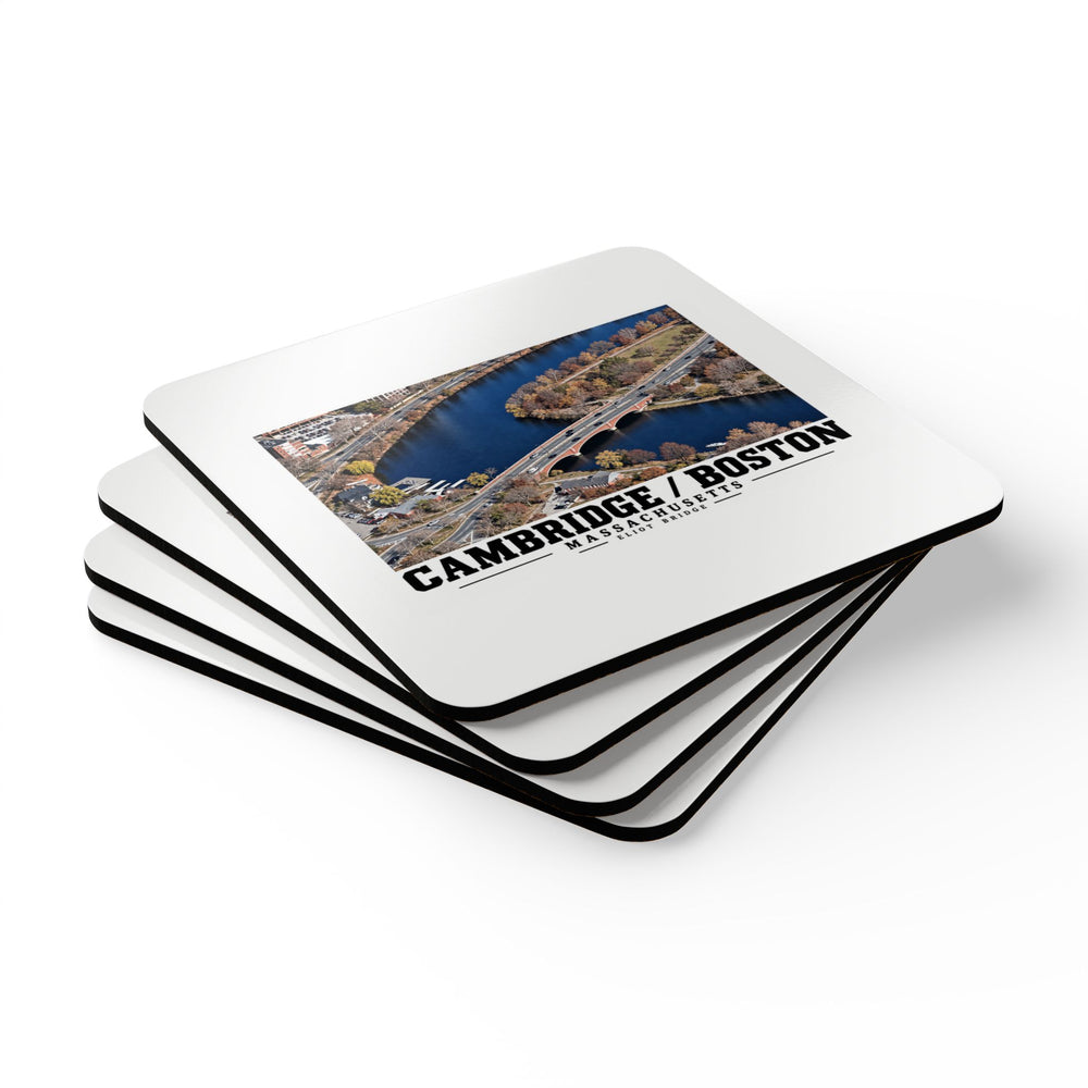 Stack of square coasters with Eliot Bridge aerial river view artwork visible on the top coaster