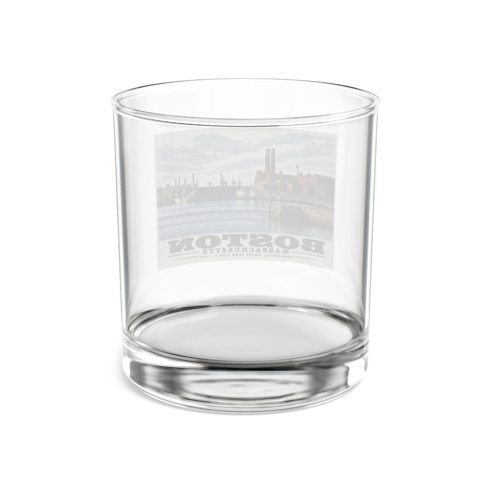 Rear view of clear rocks glass with Commercial Wharf waterfront buildings, twin chimneys and harbor water print and reversed lettering visible through the glass