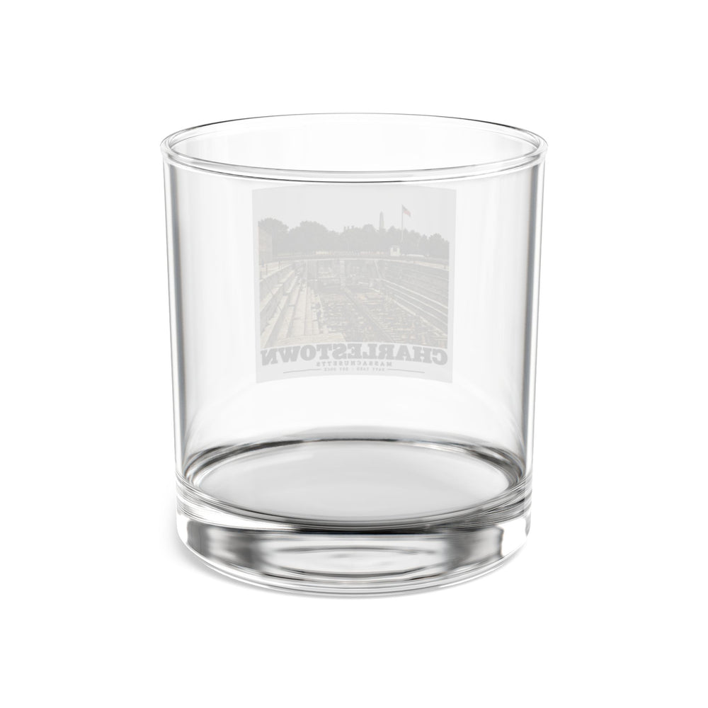 Rear of clear rocks glass showing reversed dry-dock artwork through glass
