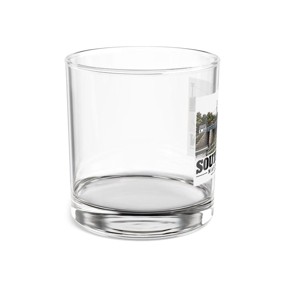 Right-side view of clear New Bridge 10 oz rocks glass, with the South Acton bridge artwork partially visible.