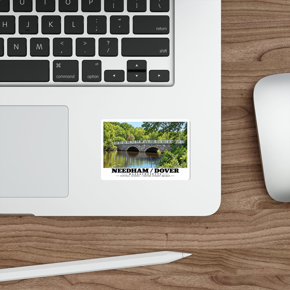 Sticker showing Central Avenue / Centre Street Bridge stone arches and river artwork on a laptop beside its keyboard