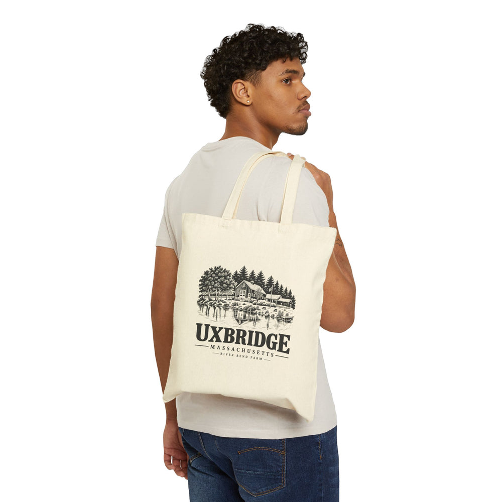 Natural canvas tote with Uxbridge River Bend Farm artwork shown worn over the shoulder