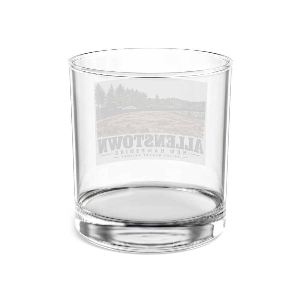 Transparent reverse with front artwork visible through glass of Bailey Quarry Railway rocks glass, Allenstown, New Hampshire.