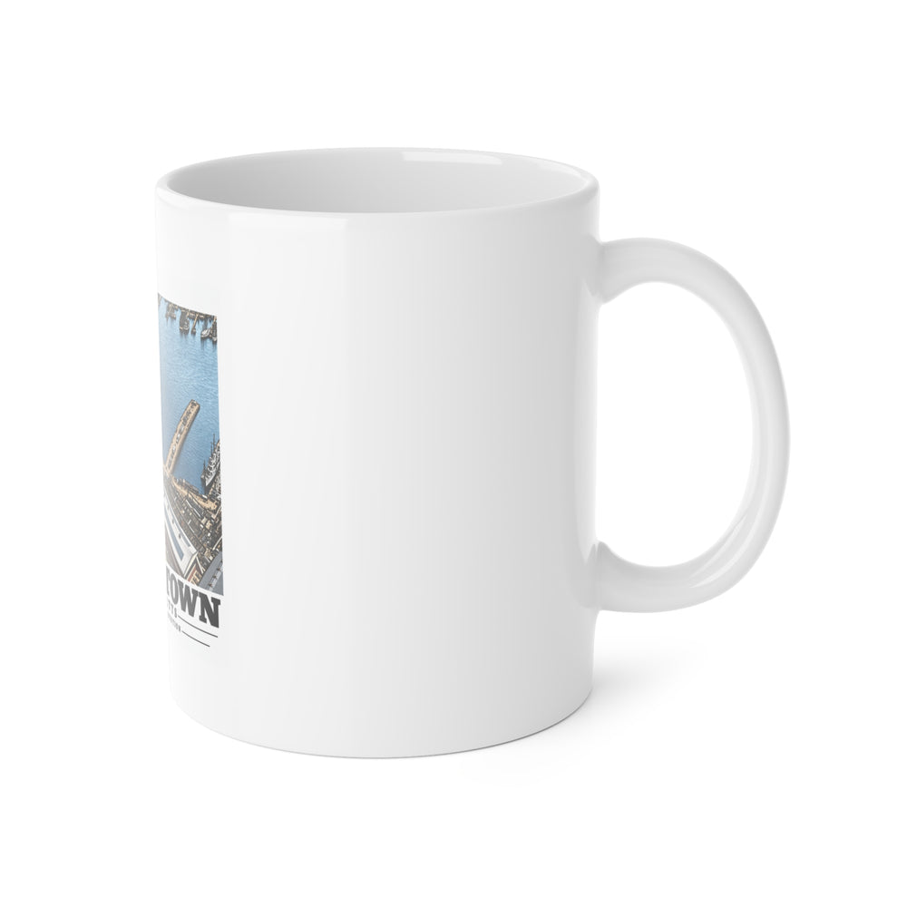 Right handle view of the Dry Dock 5 and Constitution Pier ceramic mug, with a partial view of the artwork.