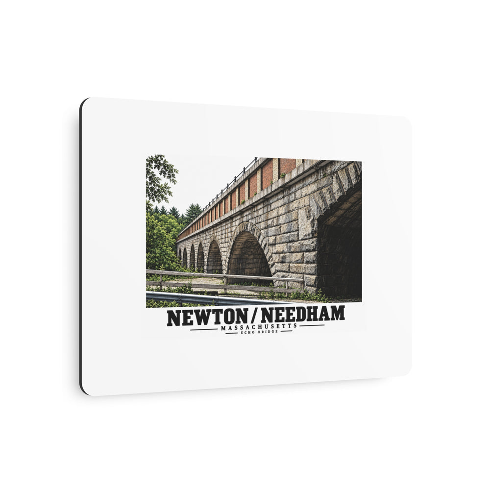 Angled metal wall art with Echo Bridge artwork showing a row of stone arches and a brick upper band, with Newton/Needham lettering.