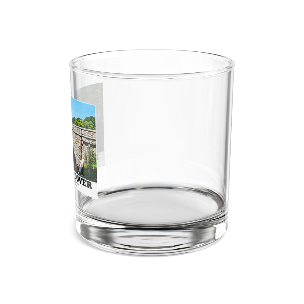 Side view of clear rocks glass with mostly unprinted surface and part of South Street Bridge stone arch and river print at left