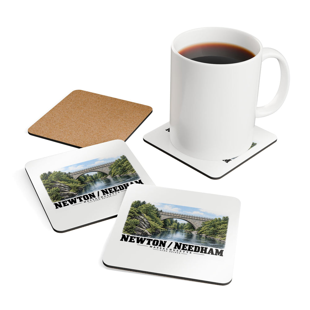 Square coasters showing printed fronts with Echo Bridge artwork showing a stone arch over a river and trees, with Newton/Needham lettering and a plain cork reverse, with a white mug resting on one coaster.