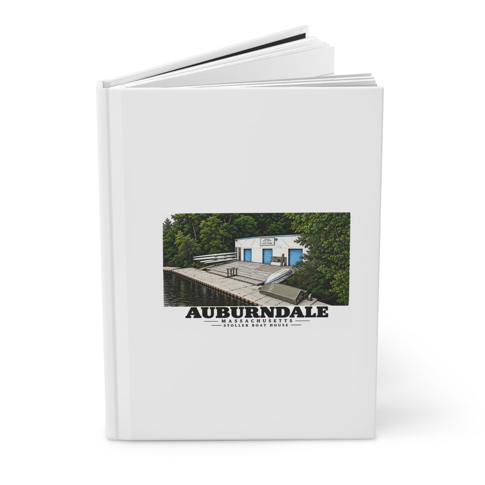 Angled view of the partly open hardcover journal with Auburndale Stoller Boathouse artwork on its front cover.