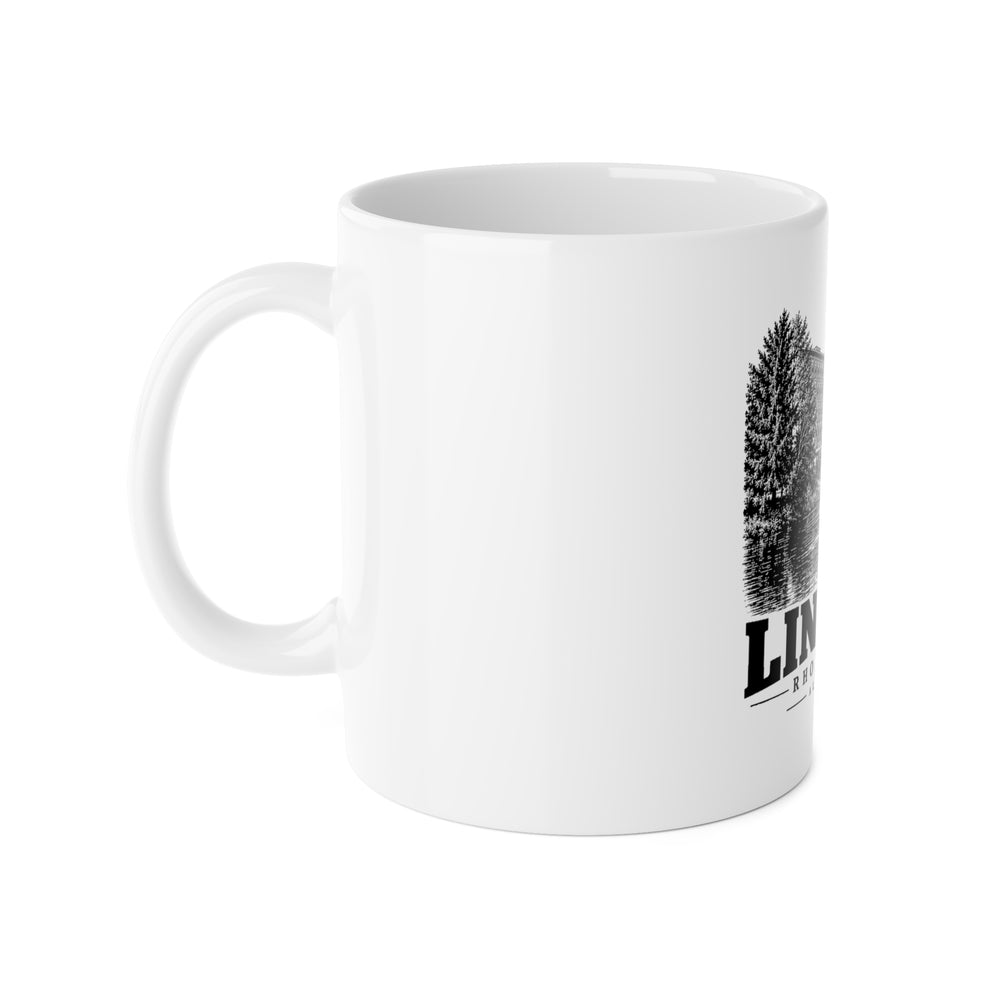 Left-side view of white 11 oz Albion Mill mug, handle on the left and partial front print, Lincoln, Rhode Island