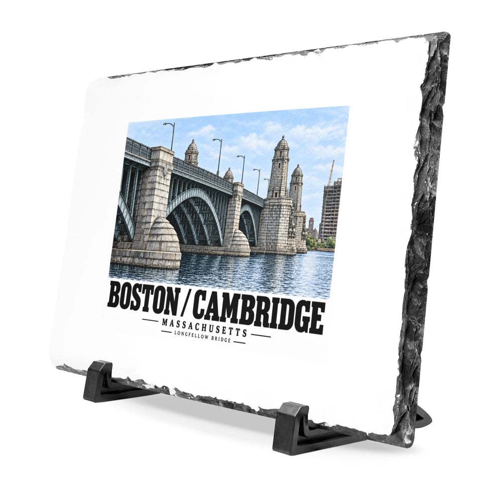 Angled slate plaque on black supports with Longfellow Bridge artwork and its rough stone edge visible.