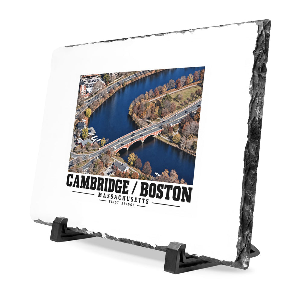Angled rough-edged slate display on black stands showing Eliot Bridge aerial river view artwork
