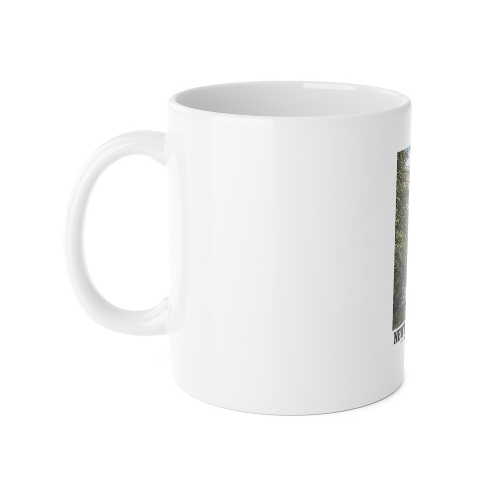 White mug with handle at left and part of the Echo Bridge portrait print at right