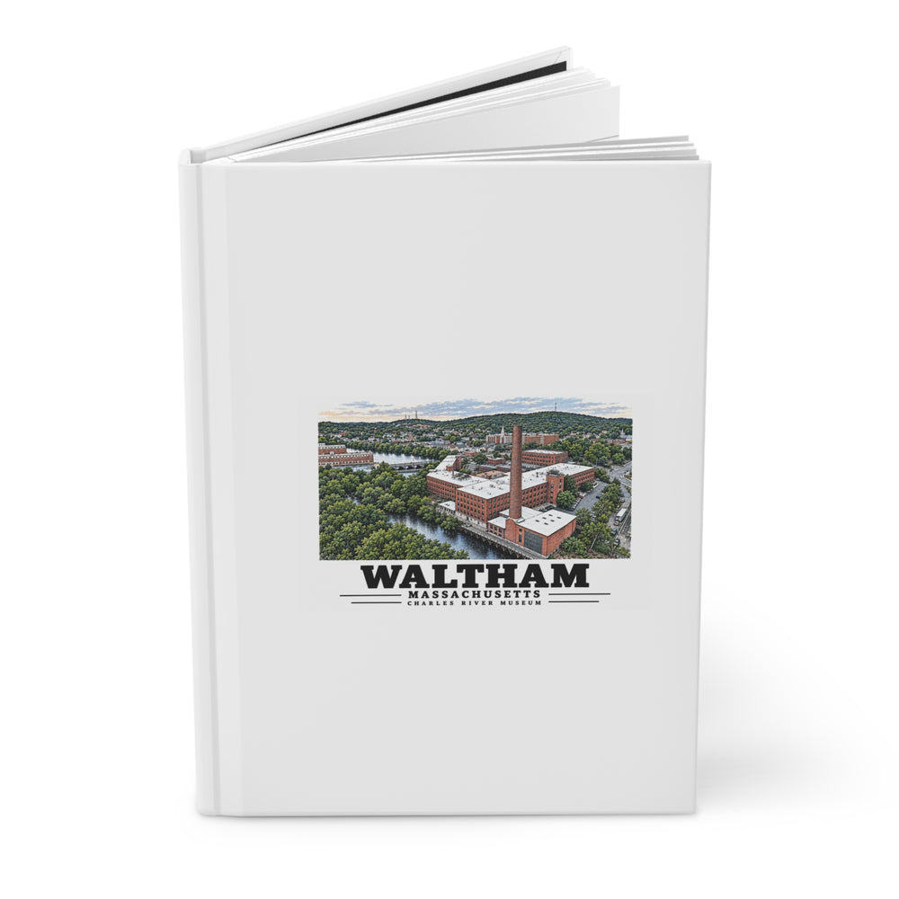 Angled view of the partly open hardcover journal with Waltham Charles River Museum artwork on its front cover.